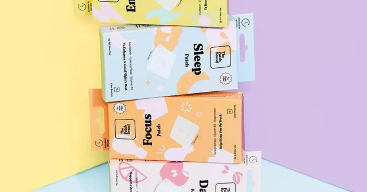 Vitamin patch packs labeled Energy, Sleep, Focus, and Day displayed on a pastel-colored background